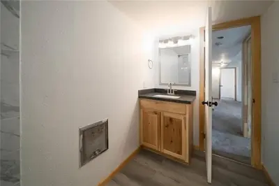 a bathroom with a sink and a mirror at Keystone Charm- Wild Irishman 3BR Mountain Escape condo in Keystone