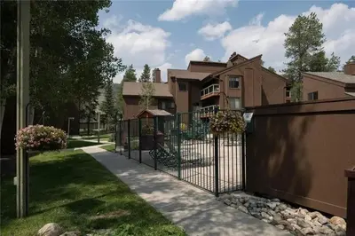 a wrought iron fence in front of a house at Keystone Charm- Wild Irishman 3BR Mountain Escape condo in Keystone