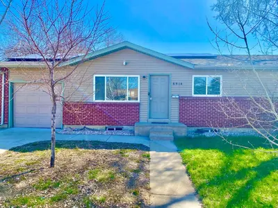 a house with a tree in front of it at Master Bedroom and Bath in Arvada