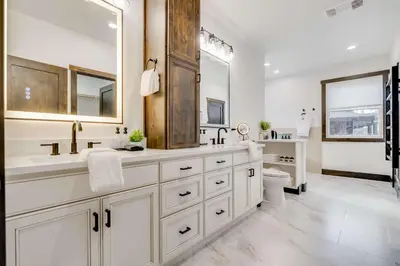 a white bathroom with two sinks and a toilet at Keystone 5BD 5 5BT Luxury Remodel 2025 & Pets in Keystone