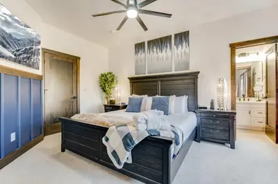 a bedroom with a large bed and a ceiling fan at Keystone 5BD 5 5BT Luxury Remodel 2025 & Pets in Keystone
