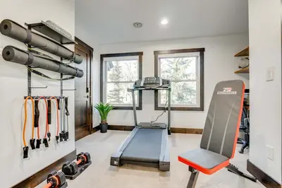 a gym with a treadmill and a bench in a room at Keystone 5BD 5 5BT Luxury Remodel 2025 & Pets in Keystone