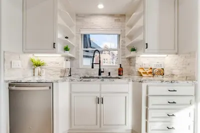 a white kitchen with a sink and a window at Keystone 5BD 5 5BT Luxury Remodel 2025 & Pets in Keystone