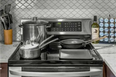 a stove with pots and pans on top of it at New Listing 3BR Frisco Condo - Ski and Bus Access in Frisco