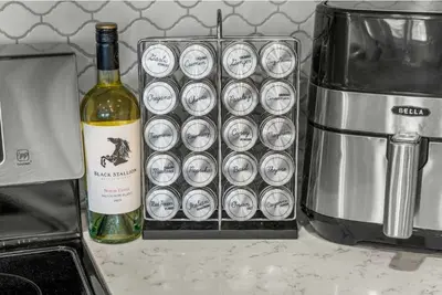 a bottle of wine sitting next to a basket of cups at New Listing 3BR Frisco Condo - Ski and Bus Access in Frisco