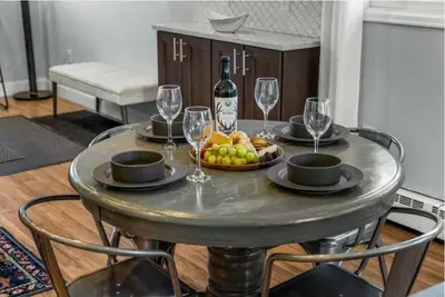 a table with a plate of fruit and wine glasses at New Listing 3BR Frisco Condo - Ski and Bus Access in Frisco