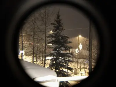 a view of a christmas tree from a window at Downtown Luxury + Hot Tubs; Walkable Winter Park in Winter Park
