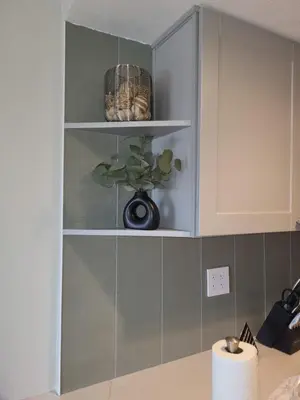 a shelf in a kitchen with a plant on it at Comfortable 1 Bed 1 Bath Loft in Uptown Denver in Denver