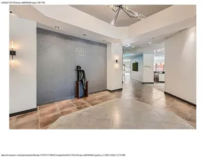 a hallway with a large wall in a building at Comfortable 1 Bed 1 Bath Loft in Uptown Denver in Denver