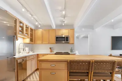 a kitchen with wooden cabinets and a kitchen island at 317 Lodge at Lake Dillon condo in Dillon