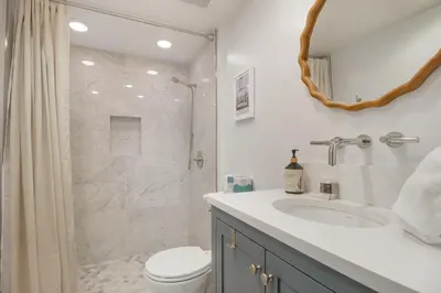 a bathroom with a shower and a toilet and a sink at 317 Lodge at Lake Dillon condo in Dillon