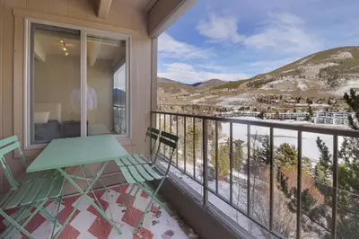 a balcony with a table and a view at 317 Lodge at Lake Dillon condo in Dillon