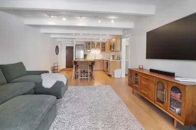 a living room with a couch and a flat screen tv at 317 Lodge at Lake Dillon condo in Dillon