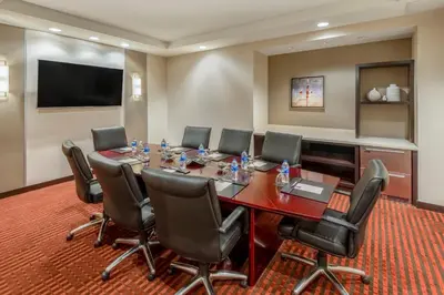 a conference room with a long table and chairs at Hyatt Place Denver Downtown in Denver