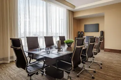 a conference room with a large table and chairs at Hyatt Regency Aurora-Denver Conference Center in Aurora