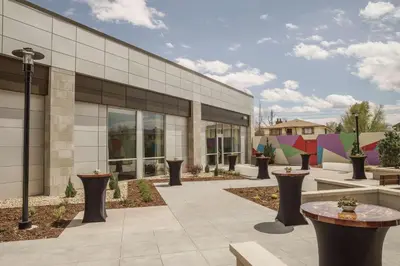 a building with tables and benches in front of it at Hyatt Regency Aurora-Denver Conference Center in Aurora