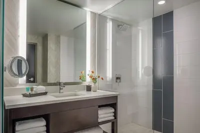 a bathroom with a sink and a shower at Hyatt Regency Aurora-Denver Conference Center in Aurora