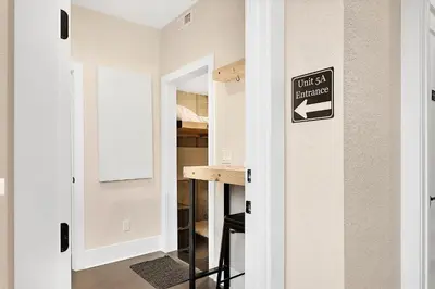 a room with a sign that reads just a bedroom at Townhouse in Santa Fe Arts District in Denver