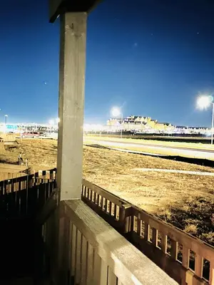 a pole in front of a field with a race track at New Vacation Home 8 min walking distance from Gaylord Hotel in Aurora
