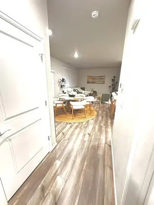 a living room with a table and a dining room at New Vacation Home 8 min walking distance from Gaylord Hotel in Aurora