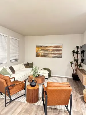a living room with a couch and chairs at New Vacation Home 8 min walking distance from Gaylord Hotel in Aurora