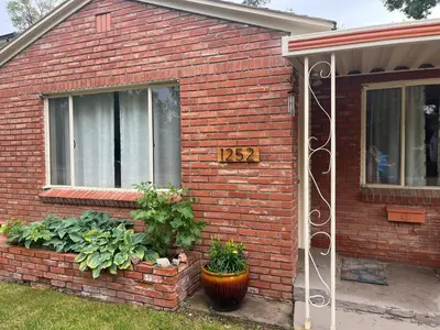a brick house with a sign on the side of it at Little Brick House- pet friendly in Loveland