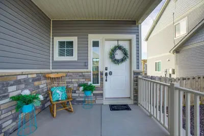a front door of a house with a wreath on it at Home Gym and Fenced Backyard Aurora Family Home! in Aurora