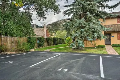 an empty parking lot in front of a house at Estes Escape-Walk Downtown - Free Mountain Coaster in Estes Park