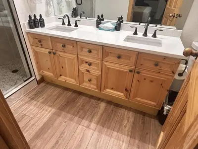 a bathroom with a double sink and a shower at Renovated 3BR Mountain Condo - Kids Ski Free condo in Keystone