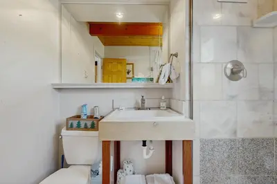 a bathroom with a sink and a shower at The Meandering Moose in Grand Lake
