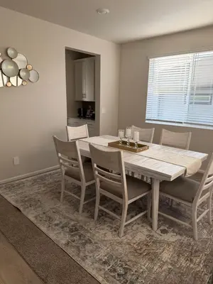 a dining room with a table and chairs at Bsnsn in Commerce City