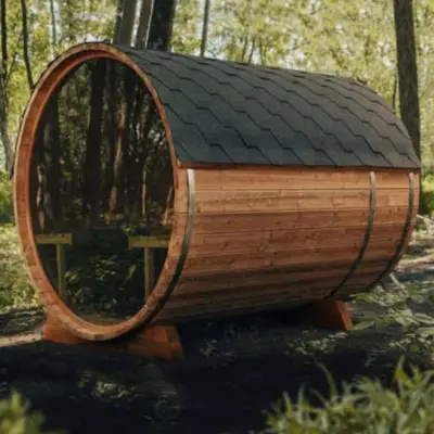 a wooden round house with a black roof at The Rusty Skillet Spa and Ranch in Boulder