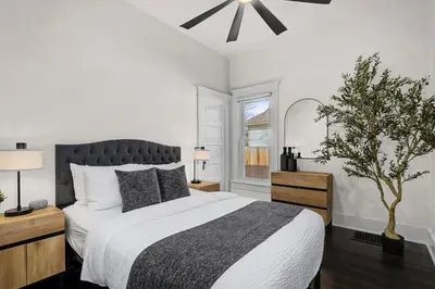 a bedroom with a large bed and a window at The Wild Peony Walk to Old Town FC and CSU Campus in Fort Collins