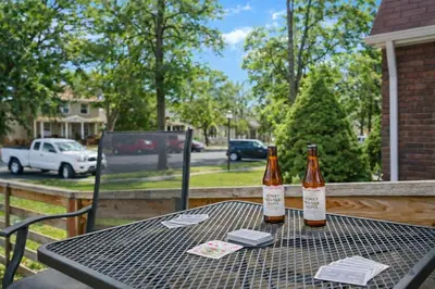 two bottles of beer sitting on top of a table at Campus Corner Retreat Two King Beds and Dog Friendly in Fort Collins