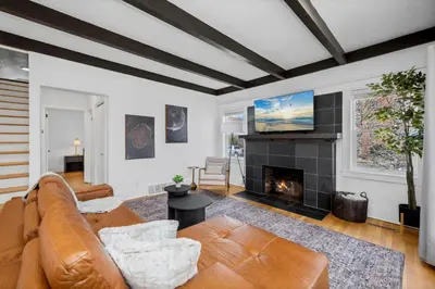 a living room with a couch and a fireplace at Campus Corner Retreat Two King Beds and Dog Friendly in Fort Collins