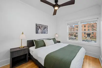a bedroom with a bed and a ceiling fan at Campus Corner Retreat Two King Beds and Dog Friendly in Fort Collins