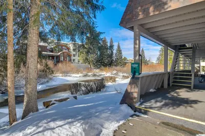 a snow covered yard with a building in the background at 3 Mi to Slopes! Family-Friendly Winter Park Escape in Winter Park