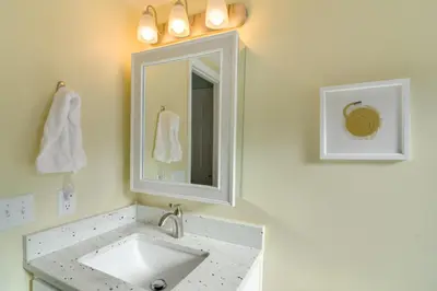 a bathroom with a sink and a mirror at 3 Mi to Slopes! Family-Friendly Winter Park Escape in Winter Park