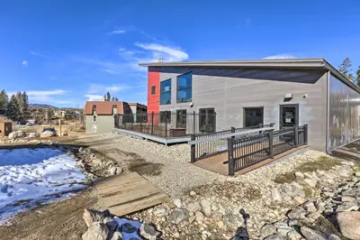 a modular home with a deck and a yard at 3 Mi to Slopes! Family-Friendly Winter Park Escape in Winter Park