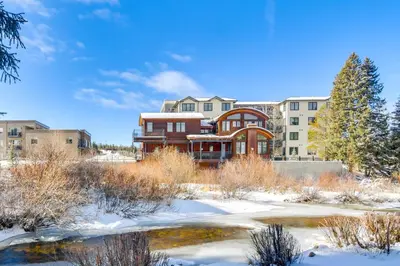 a building with snow in front of condos at 3 Mi to Slopes! Family-Friendly Winter Park Escape in Winter Park
