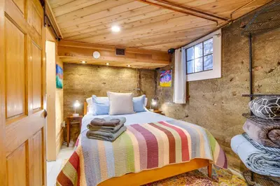 a bedroom with a bed in a room at Explore CU! Unique Studio with Private Courtyard in Boulder