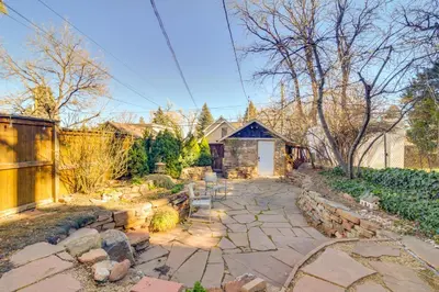 a backyard with a stone pathway and a house at Explore CU! Unique Studio with Private Courtyard in Boulder