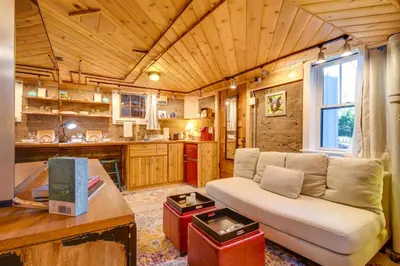 a living room with a couch in a kitchen at Explore CU! Unique Studio with Private Courtyard in Boulder