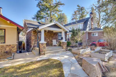 a home with a stone house with a driveway at Explore CU! Unique Studio with Private Courtyard in Boulder