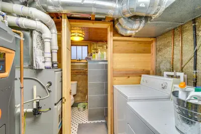 a laundry room with a washer and dryer at Explore CU! Unique Studio with Private Courtyard in Boulder