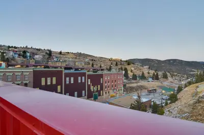a view of a city from a red roof at Steps to Casinos and Shuttle! Central City Home Base in Central City
