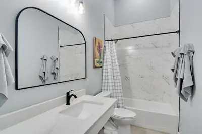 a white bathroom with a sink and a toilet at Steps to Casinos and Shuttle! Central City Home Base in Central City