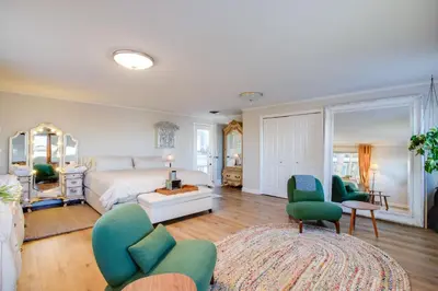 a large living room with a bed and chairs at 2 Mi to Old Town Pet-Friendly Home Base in Arvada in Arvada