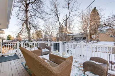 a snowy deck with chairs and a white fence at 2 Mi to Old Town Pet-Friendly Home Base in Arvada in Arvada