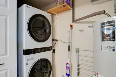 two washer and dryer in a laundry room at Work and Play Near Old Town Arvada Pets Welcome! in Arvada